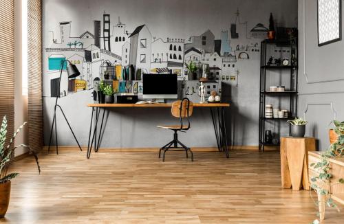 Chair,At,Wooden,Table,With,Computer,Monitor,And,Plants,In