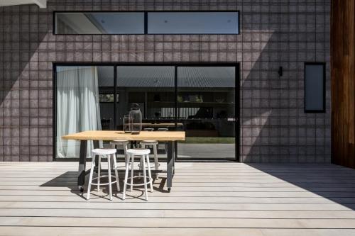 Sunny,Outdoor,Entertaining,Deck,With,Triple,Glass,Sliding,Doors